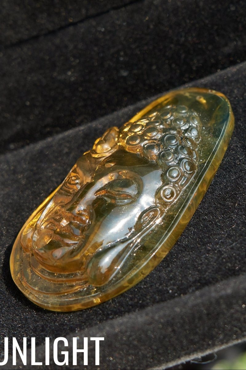 Amber Dominican half face carved buddha - Larimar Creations