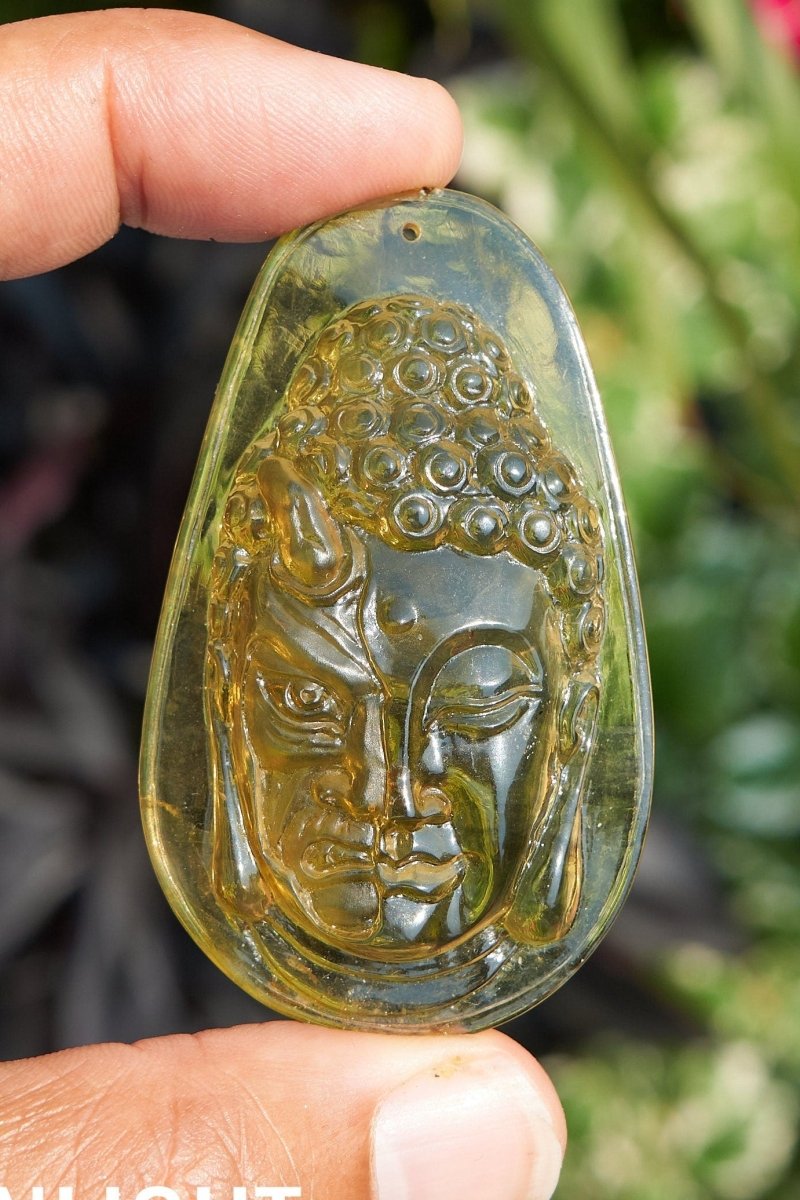 Amber Dominican half face carved buddha - Larimar Creations