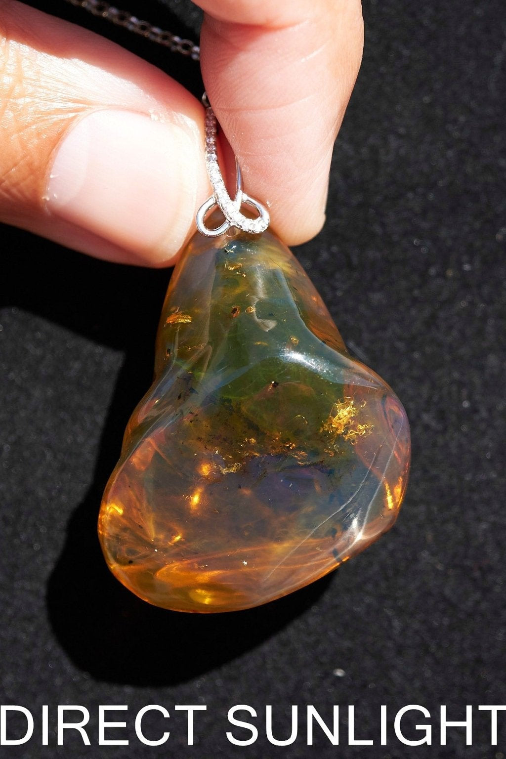 Blue Amber Dominican raw cabochon gemstone with natural vibrant hues