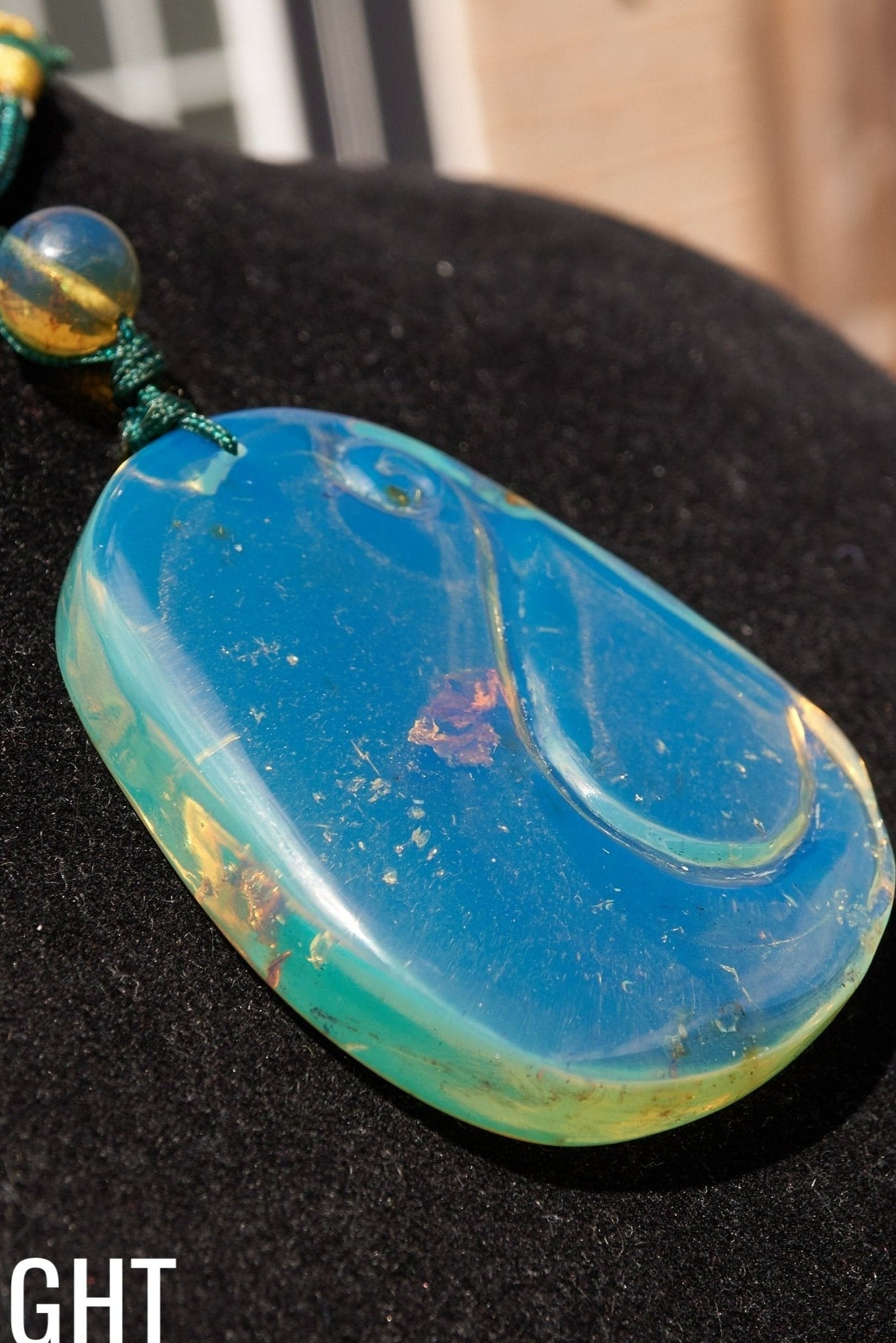 Blue Amber Dominican Pendant Necklace Bell carving shape. - Larimar Creations
