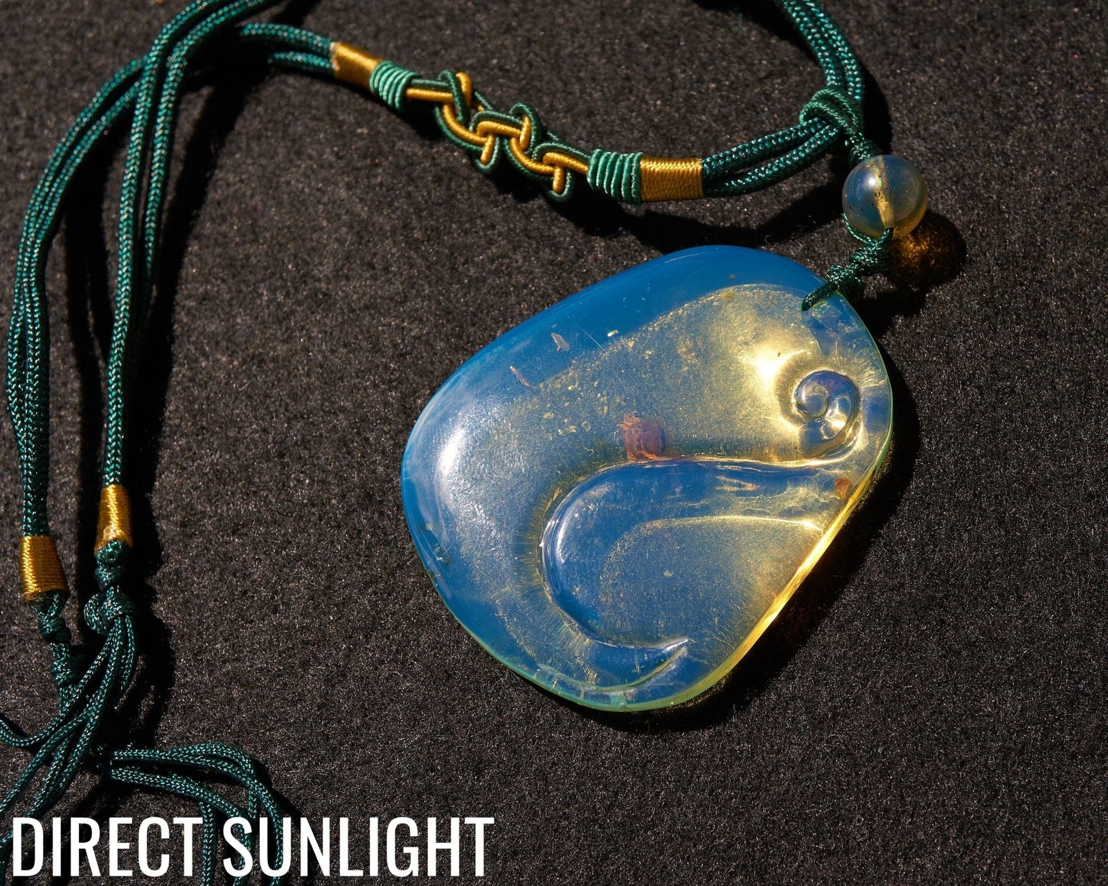Blue Amber Dominican Pendant Necklace Bell carving shape. - Larimar Creations