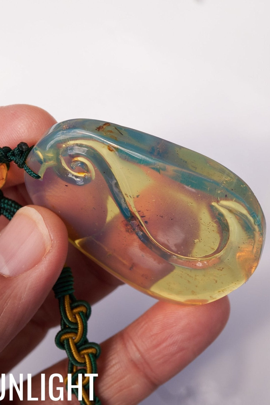 Blue Amber Dominican Pendant Necklace Bell carving shape. - Larimar Creations
