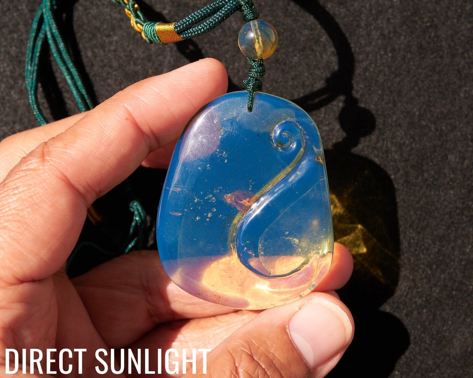 Blue Amber Dominican Pendant Necklace Bell carving shape. - Larimar Creations