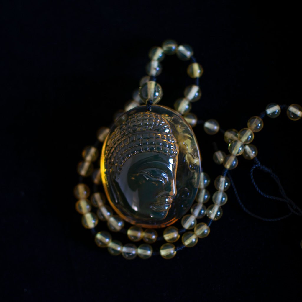 Handcrafted Dominican Amber Beaded Necklace with Buddha Pendant - Larimar Creations