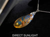 Large blue amber pendant featuring a natural cabochon amber set in sterling silver, showcasing rare Dominican blue hues