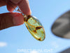 Large blue amber pendant featuring a natural cabochon amber set in sterling silver, showcasing rare Dominican blue hues