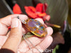 Large blue amber pendant featuring a natural cabochon amber set in sterling silver, showcasing rare Dominican blue hues