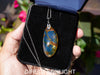 Large blue amber pendant featuring a natural cabochon amber set in sterling silver, showcasing rare Dominican blue hues