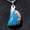 Dominican raw blue amber cabochon glistening in sunlight