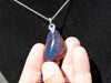 Blue Amber Dominican raw cabochon gemstone with natural vibrant hues