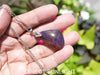 Blue Amber Dominican raw cabochon gemstone with natural vibrant hues