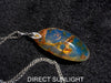 Large blue amber pendant featuring a natural cabochon amber set in sterling silver, showcasing rare Dominican blue hues