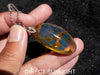 Large blue amber pendant featuring a natural cabochon amber set in sterling silver, showcasing rare Dominican blue hues