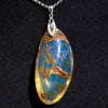 Large blue amber pendant featuring a natural cabochon amber set in sterling silver, showcasing rare Dominican blue hues