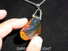 Blue Amber Dominican raw cabochon gemstone with natural vibrant hues