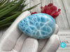 High-quality Larimar cabochon featuring a rich turquoise color and unique marbling