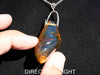 Rare fossilized Dominican amber gemstone with blue tones under natural light