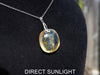 Handcrafted round Dominican blue amber pendant in sterling silver, perfect for gifts