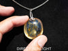 Handcrafted round Dominican blue amber pendant in sterling silver, perfect for gifts