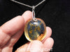 Handcrafted round Dominican blue amber pendant in sterling silver, perfect for gifts