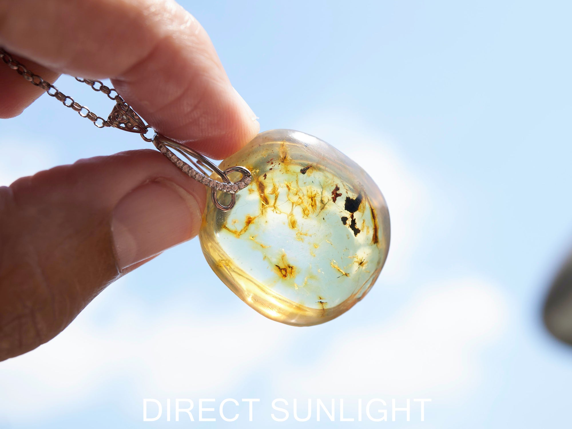 Handcrafted round Dominican blue amber pendant in sterling silver, perfect for gifts