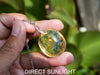 Handcrafted round Dominican blue amber pendant in sterling silver, perfect for gifts