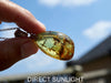 High-quality close-ups showing the polished blue amber&#39;s glow