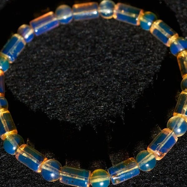 Beaded bracelet with blue Amber Dominican beads on a black background