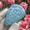 close up to a beautiful Larimar Cabochon 