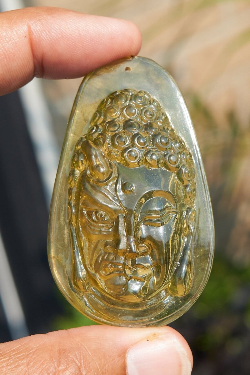 Amber Dominican half face carved buddha - Larimar Creations