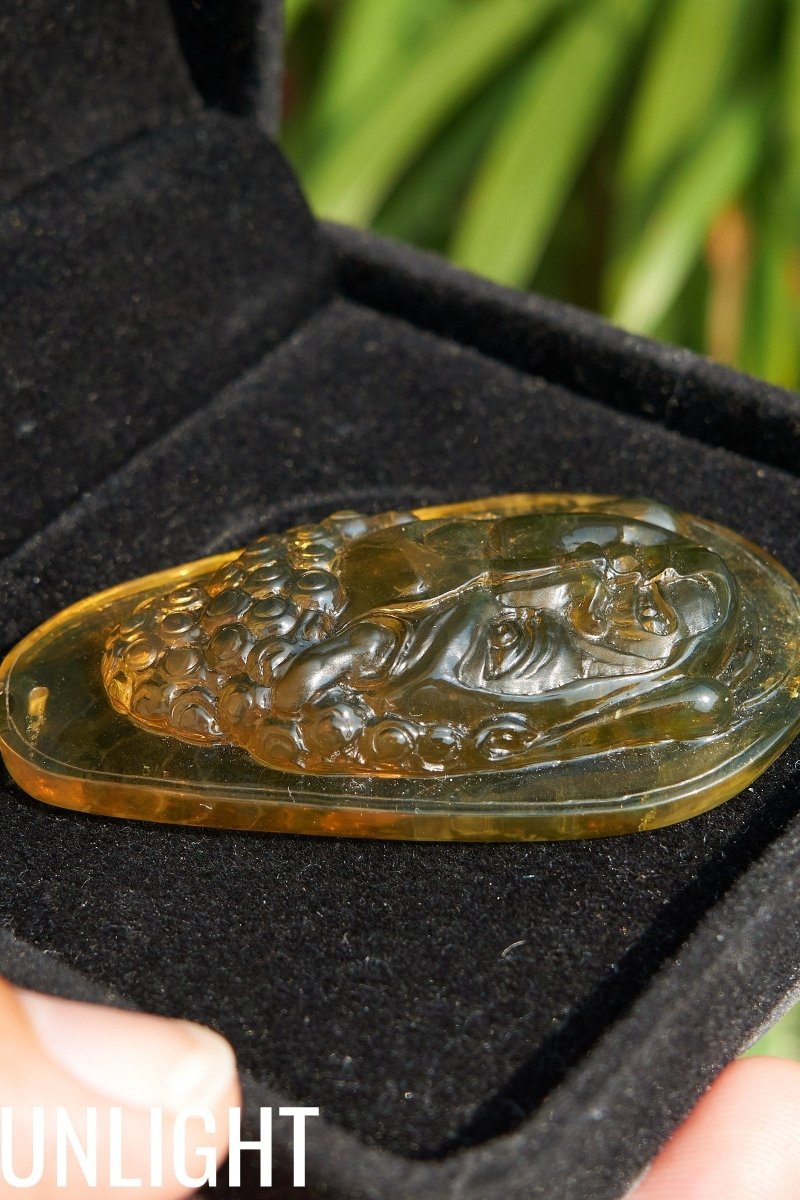 Amber Dominican half face carved buddha - Larimar Creations