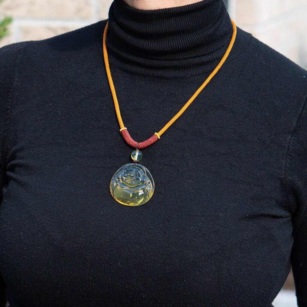 Blue Amber Dominican buddha carved in Blue - Larimar Creations