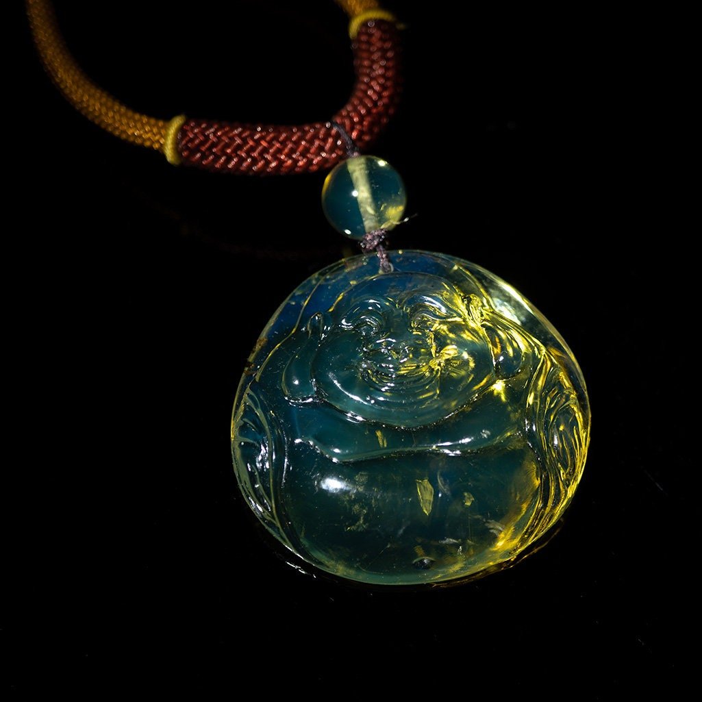 Blue Amber Dominican buddha carved in Blue - Larimar Creations