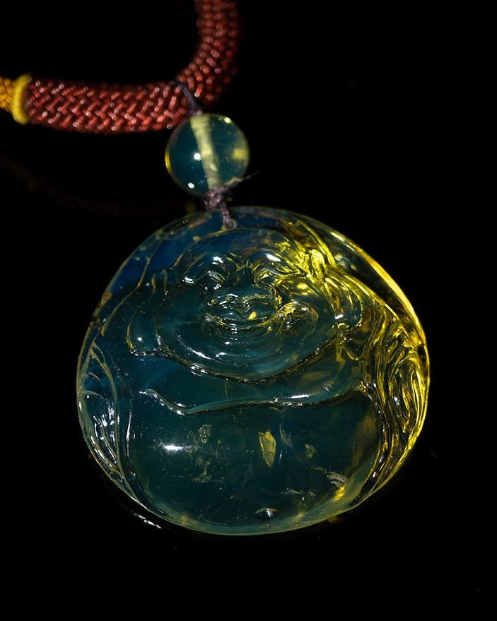 Blue Amber Dominican buddha carved in Blue - Larimar Creations