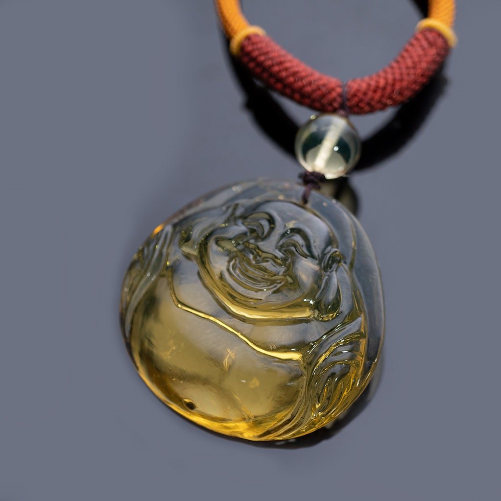 Blue Amber Dominican buddha carved in Blue - Larimar Creations