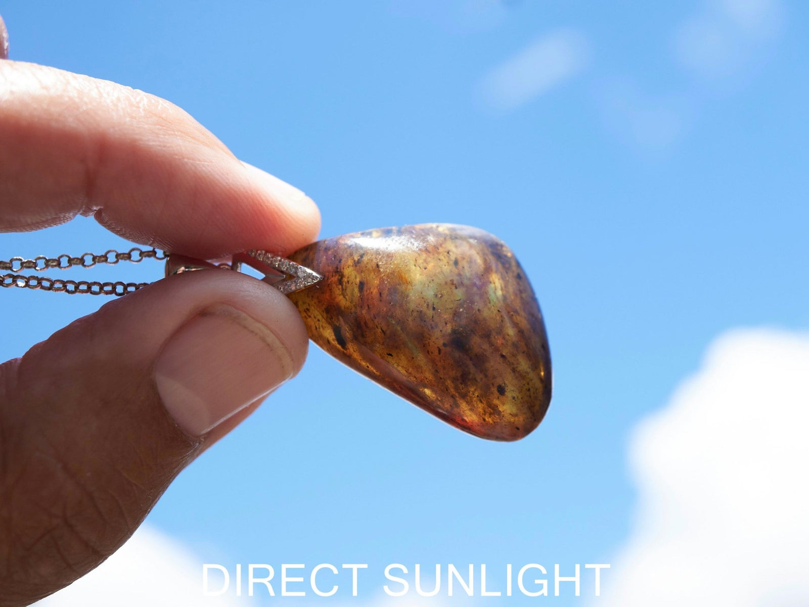 Blue Amber Dominican raw cabochon gemstone with natural vibrant hues