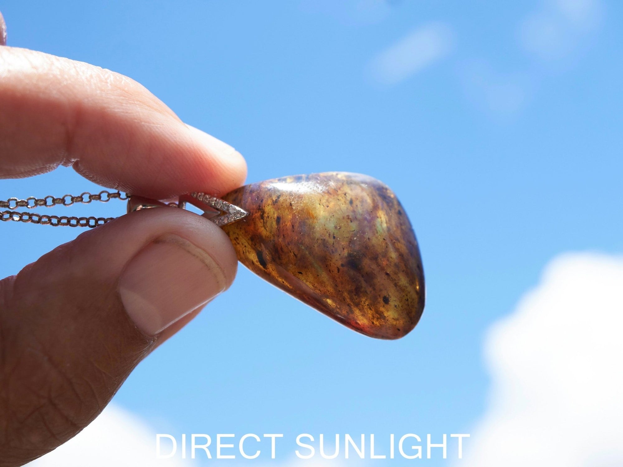 Blue Amber Dominican raw cabochon gemstone with natural vibrant hues