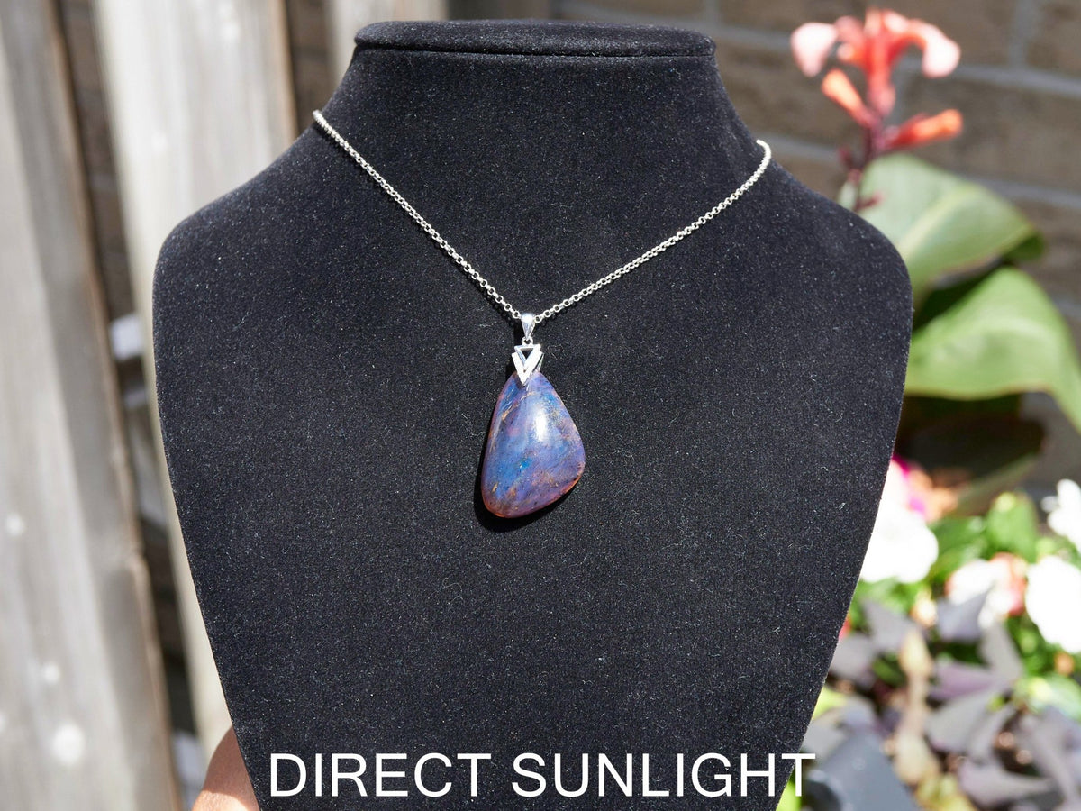 Blue Amber Dominican raw cabochon gemstone with natural vibrant hues