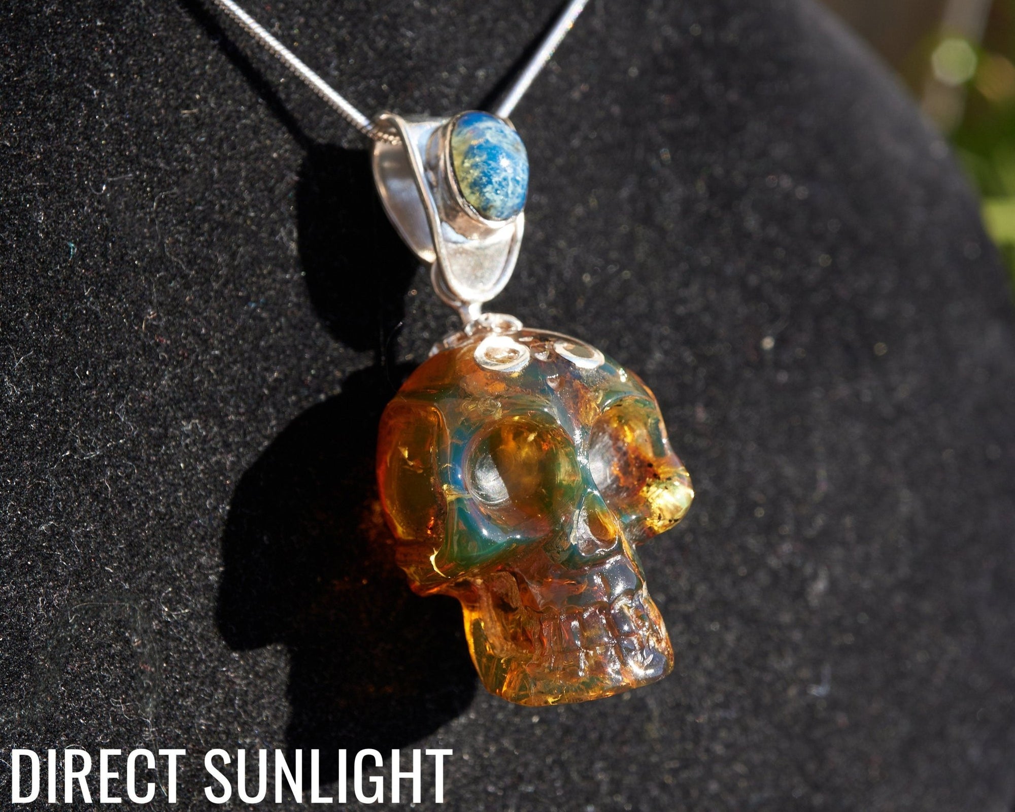 Blue &amp; Green Dominican Amber Skull Pendant | 925 Silver - Larimar Creations