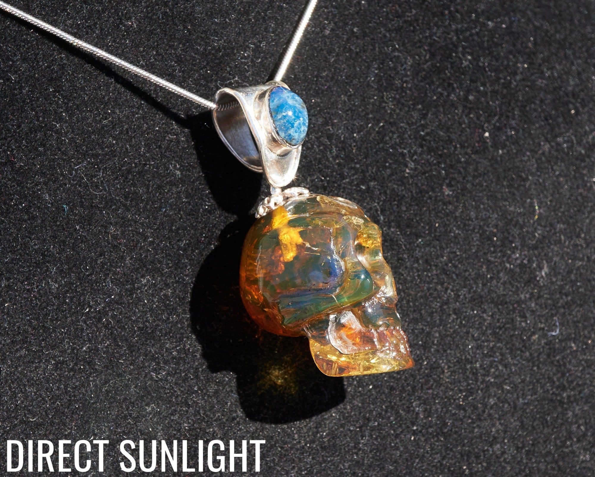 Blue &amp; Green Dominican Amber Skull Pendant | 925 Silver - Larimar Creations