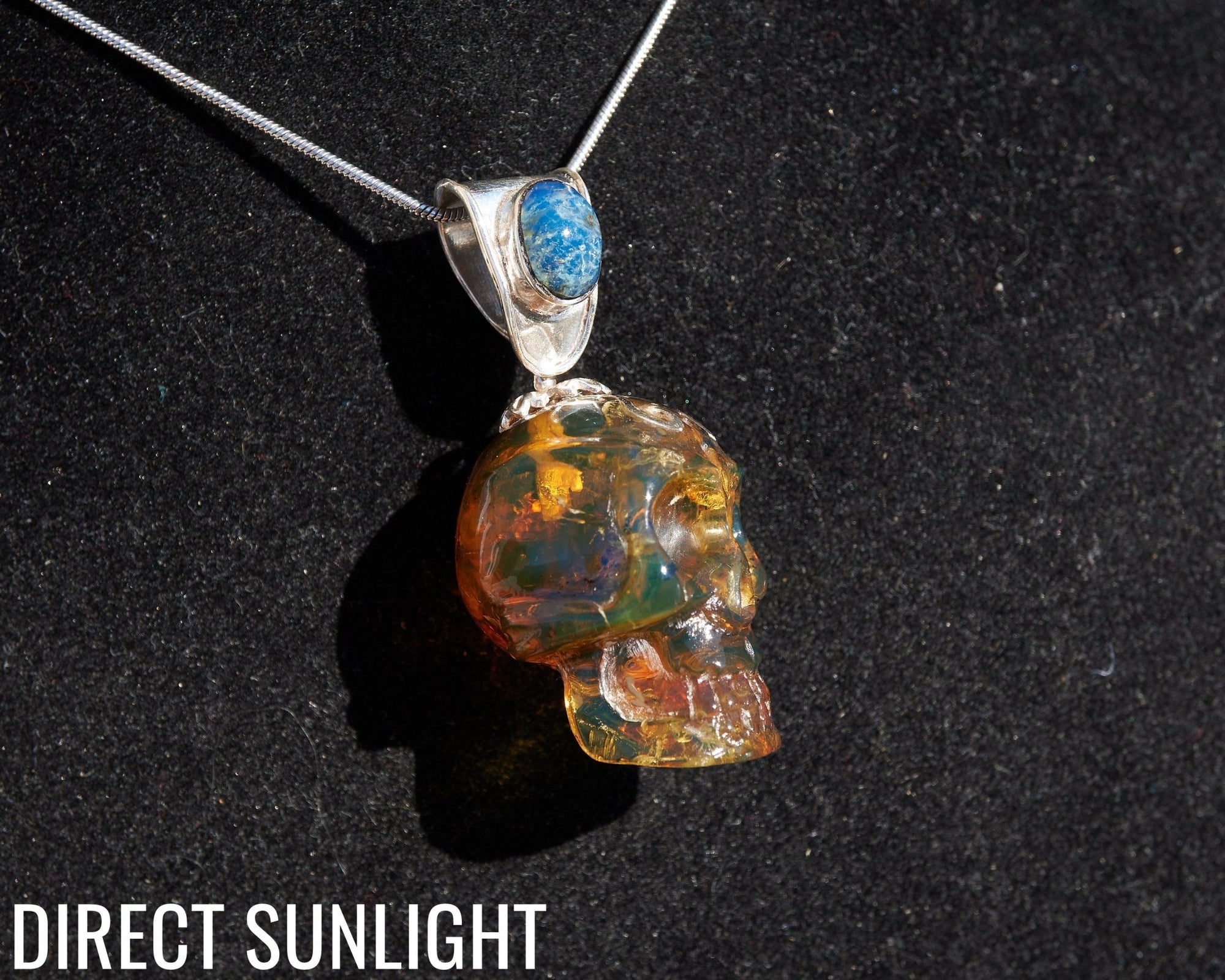 Blue &amp; Green Dominican Amber Skull Pendant | 925 Silver - Larimar Creations