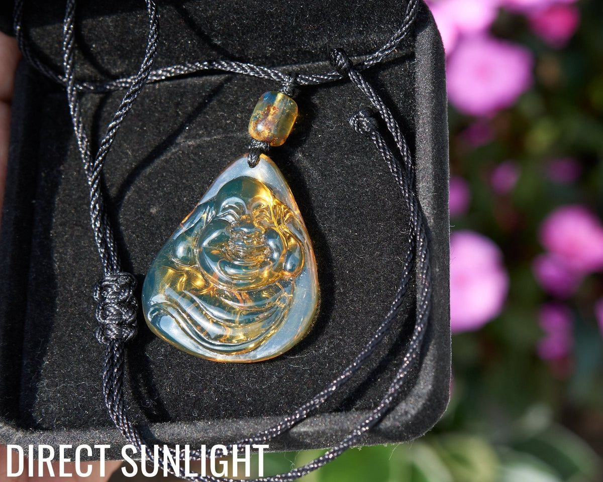Dominican Blue Amber Buddha Pendant, Buddha Carving. - Larimar Creations