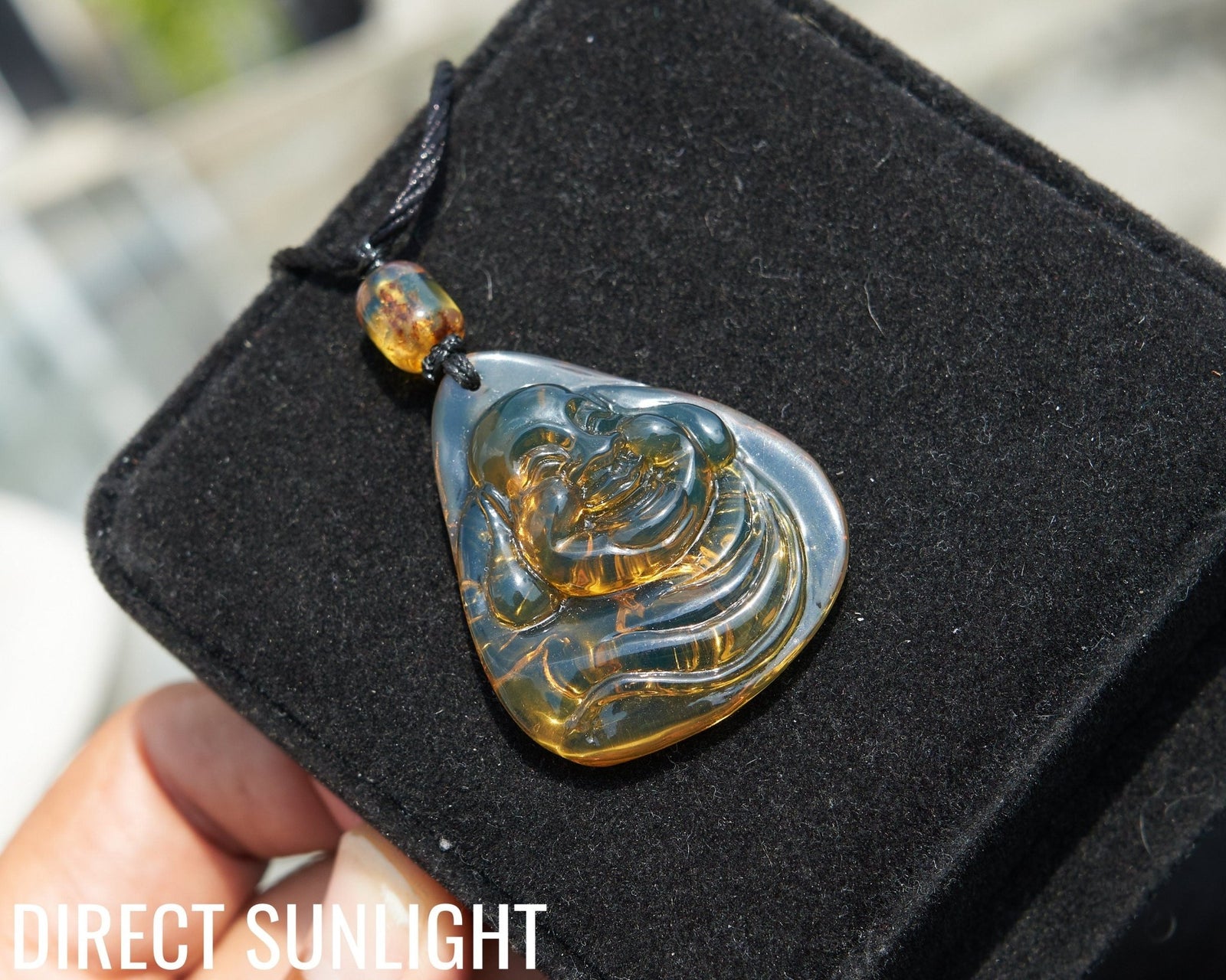 Dominican Blue Amber Buddha Pendant, Buddha Carving. - Larimar Creations