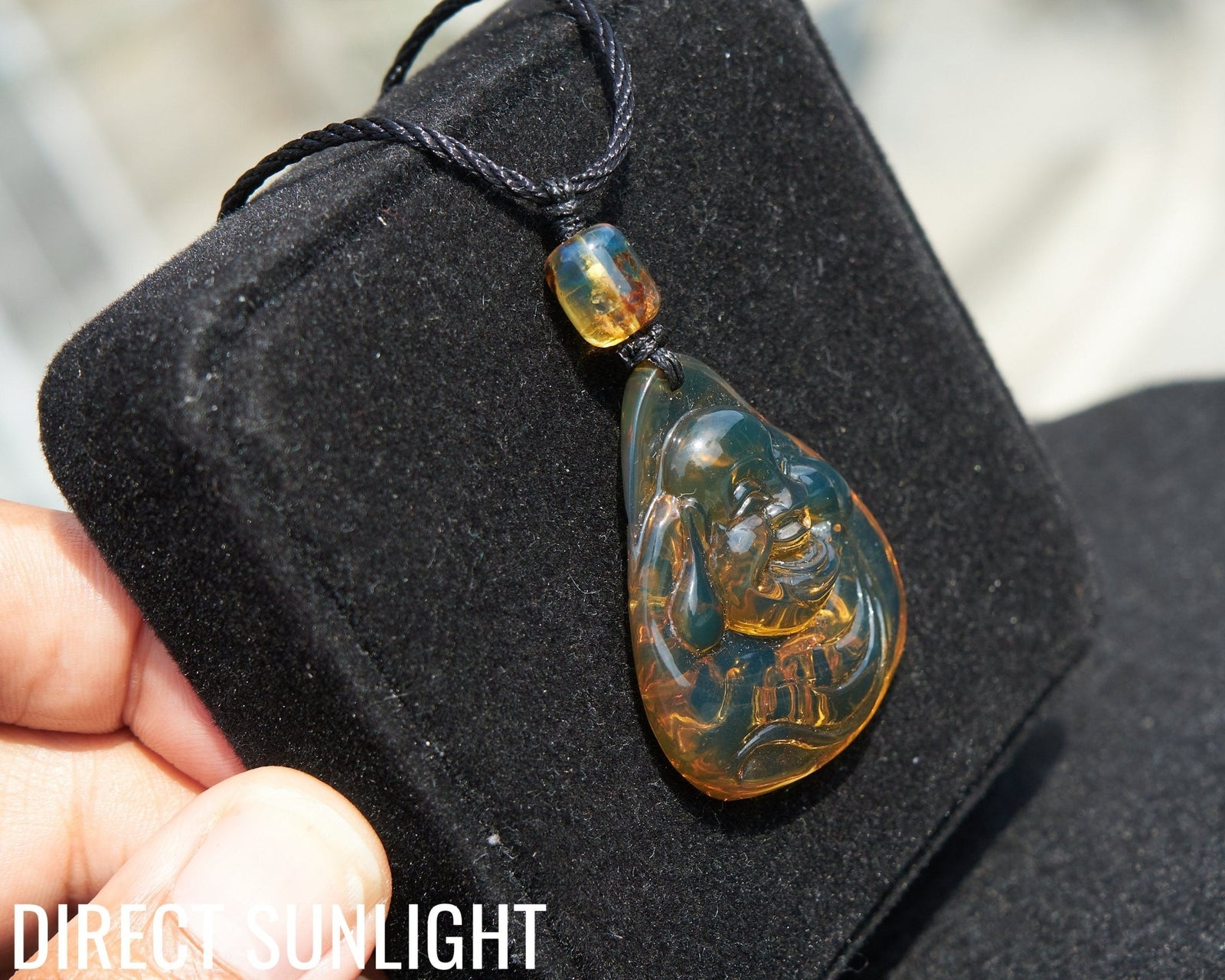 Dominican Blue Amber Buddha Pendant, Buddha Carving. - Larimar Creations