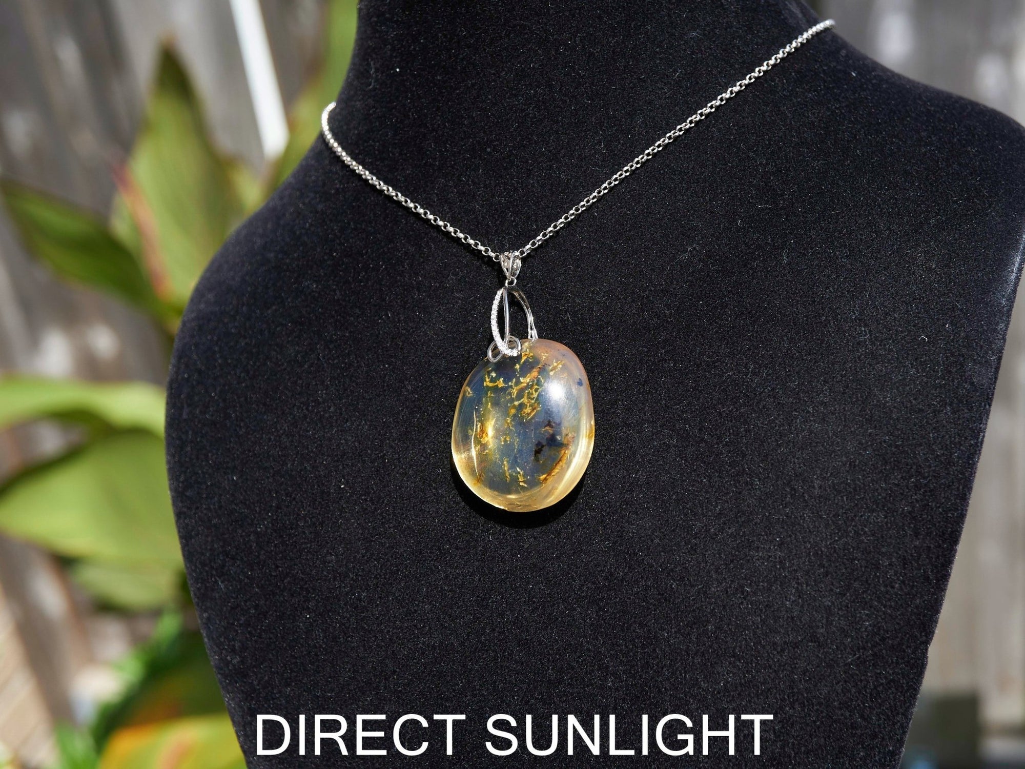 Handcrafted round Dominican blue amber pendant in sterling silver, perfect for gifts
