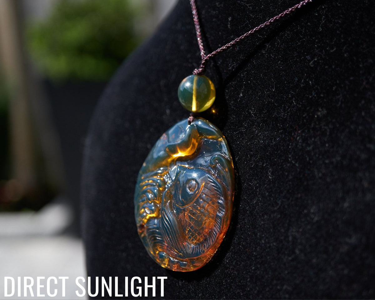 Hand - Carved Blue Dominican Amber Koi Fish Pendant | Adjustable Necklace - Larimar Creations
