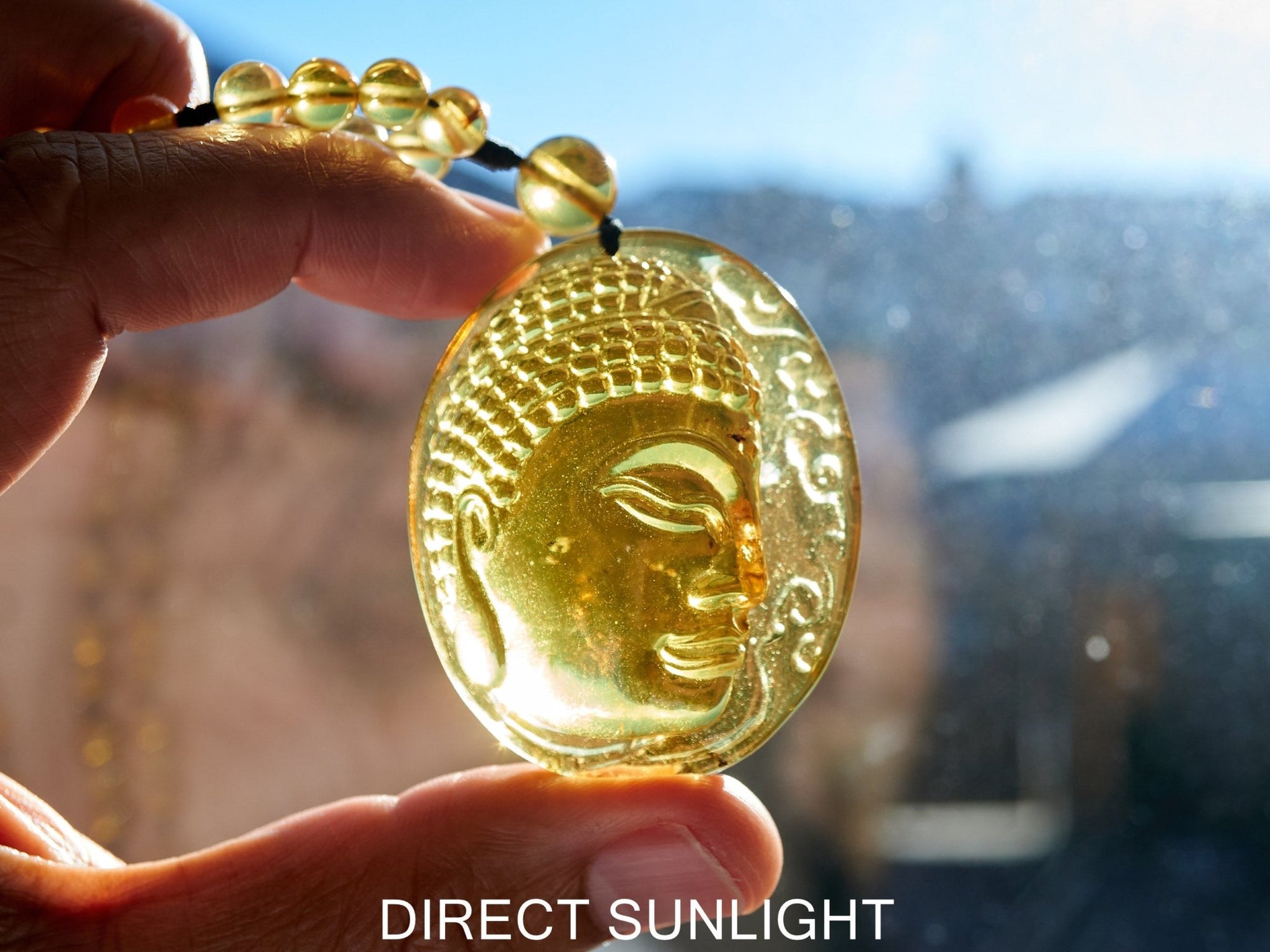 Handcrafted Dominican Amber Beaded Necklace with Buddha Pendant - Larimar Creations