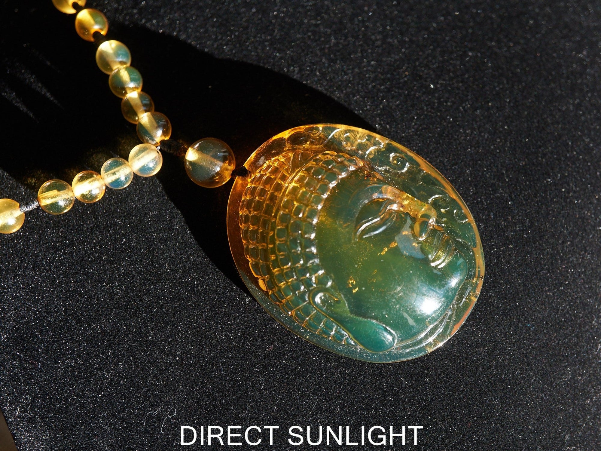 Handcrafted Dominican Amber Beaded Necklace with Buddha Pendant - Larimar Creations