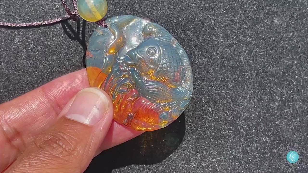 Blue Amber Dominican Koi fish hand carved pale Blue Amber Pendant with small amber bead adjustable rope koi fish pale blue amber