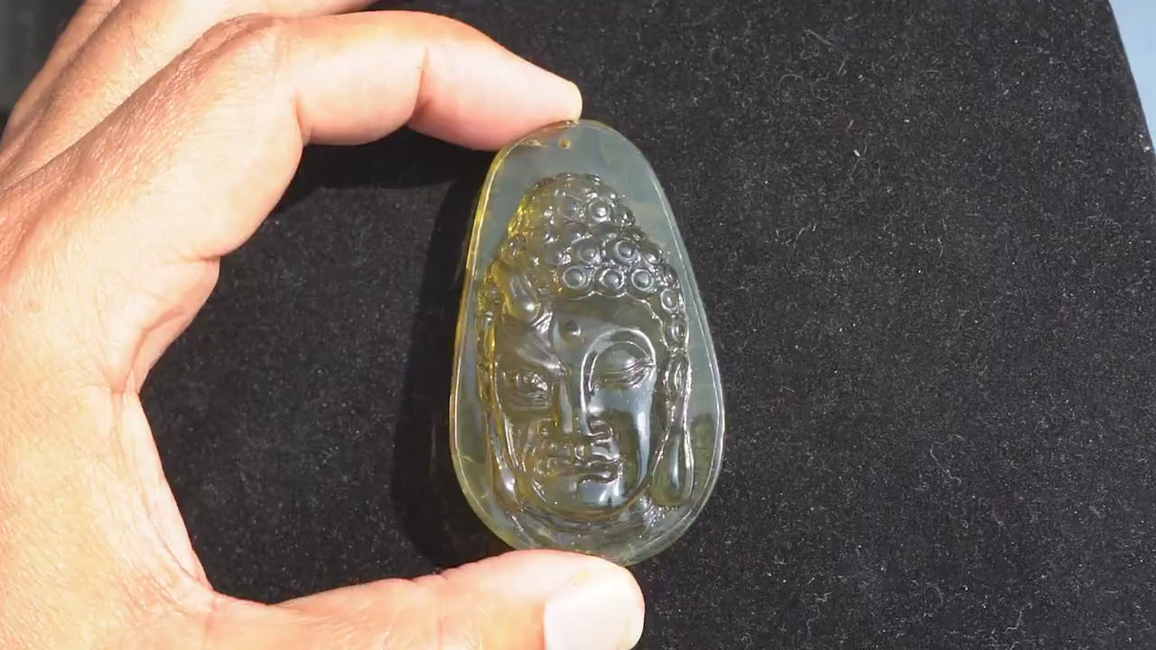 handmade amber dominican half face carved buddha two face devil and good authentic dominican amber